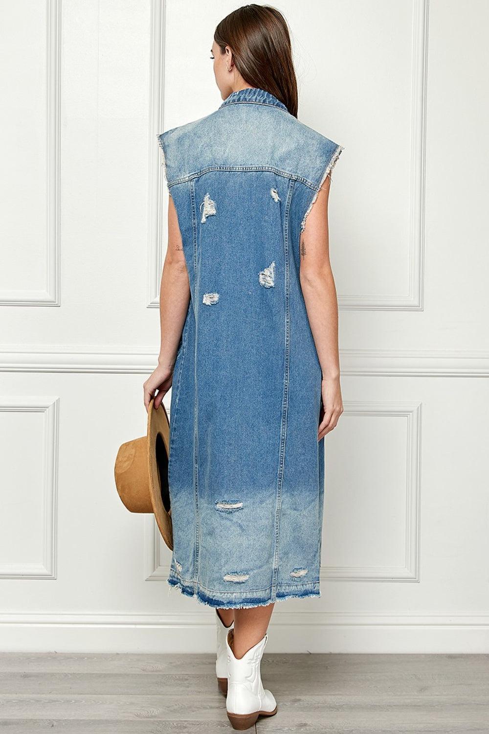 a woman in a denim dress and cowboy hat