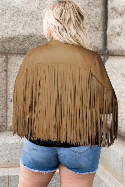 a woman wearing a brown leather jacket with fringes