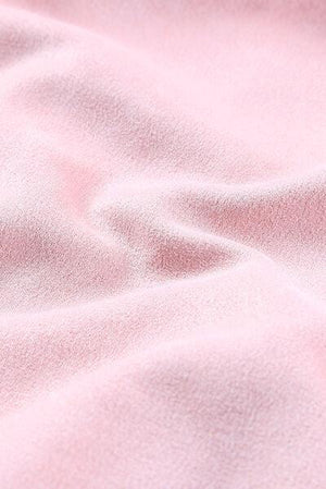 a close up of a soft pink fabric