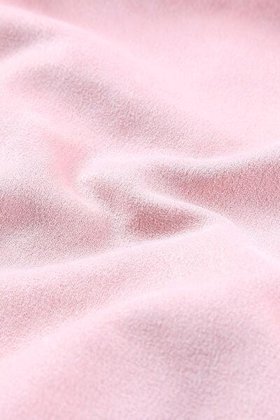 a close up of a soft pink fabric