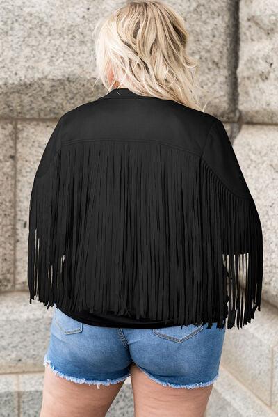 a woman wearing a black jacket with fringes