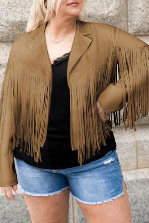 a woman wearing a brown jacket and shorts