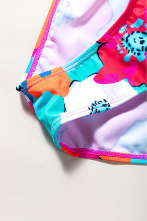 a close up of a bikini top on a white surface