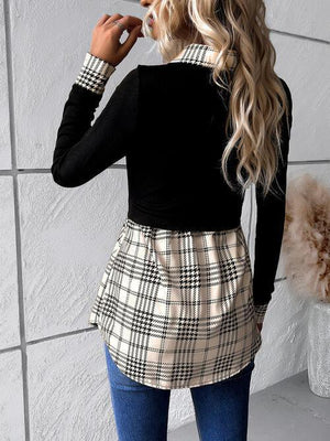 a woman wearing a black top and plaid skirt
