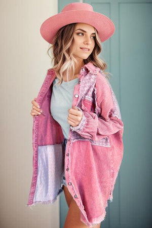 a woman wearing a pink hat and a pink jacket