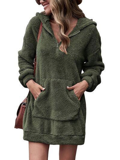 a woman wearing a green hooded sweatshirt dress