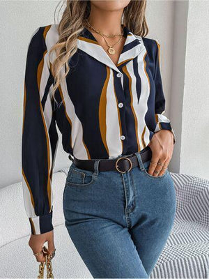 a woman wearing a striped shirt and jeans