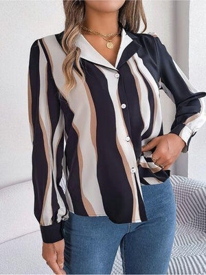 a woman wearing a striped shirt and jeans
