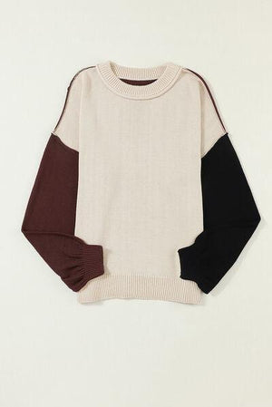 a white sweater with brown and black sleeves