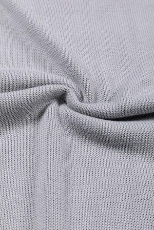 a close up view of a grey knit fabric
