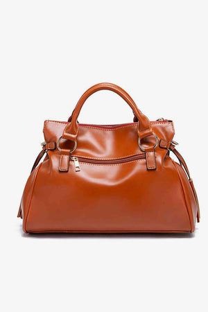 a brown handbag on a white background