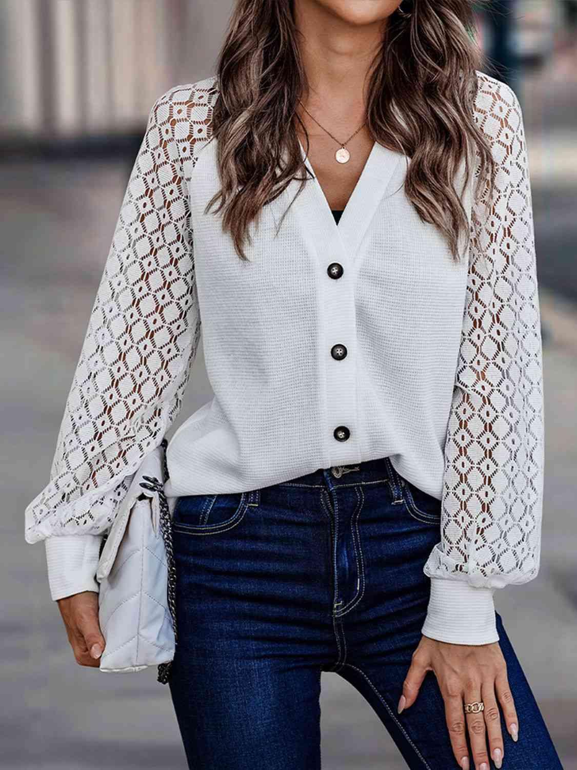 a woman wearing a white blouse and jeans