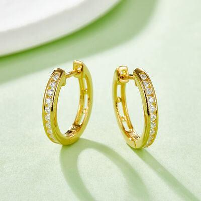 a pair of yellow gold hoop earrings with diamonds