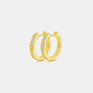 a pair of yellow gold hoop earrings with diamonds