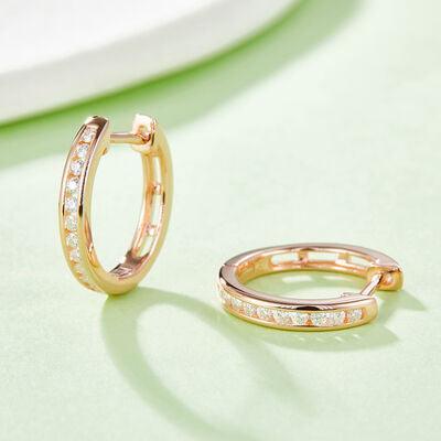 a pair of gold and diamond hoop earrings