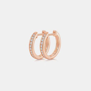a pair of rose gold hoop earrings with diamonds