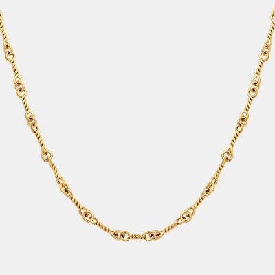 a gold necklace with a chain on a white background