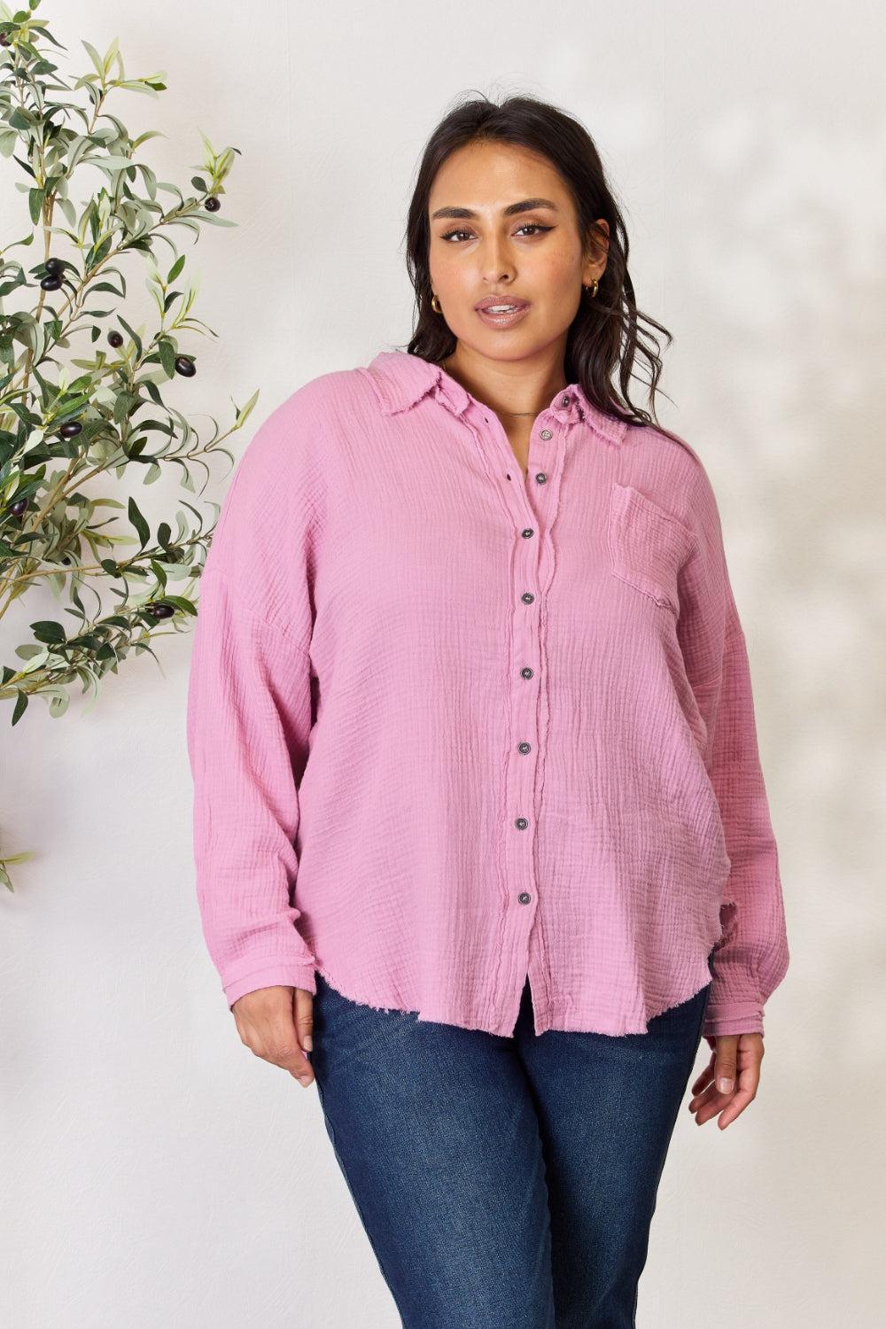 a woman wearing a pink shirt and jeans