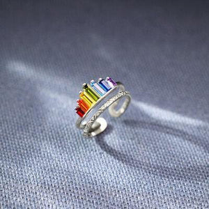a rainbow colored ring on a blue background