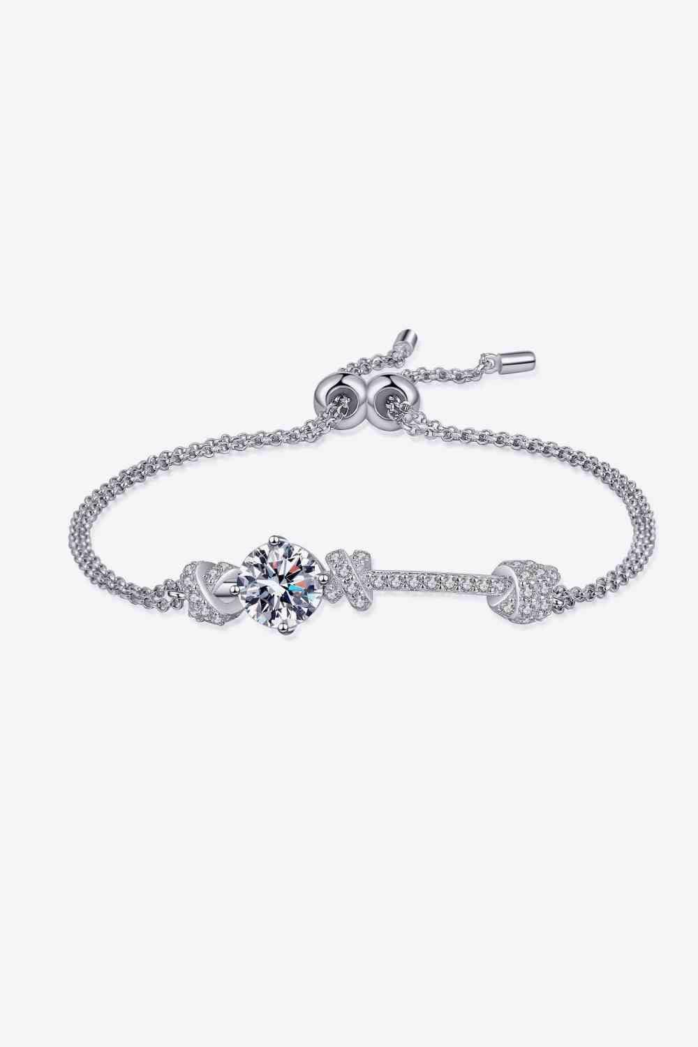 a bracelet with a heart and two hearts on it