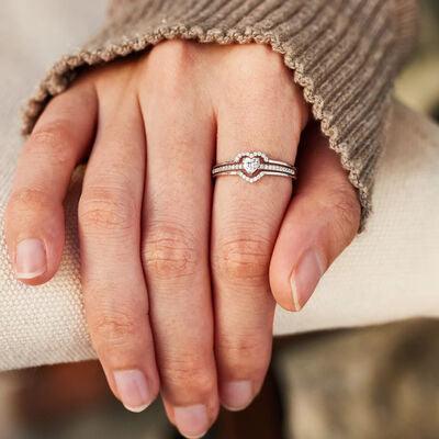 a close up of two people holding hands