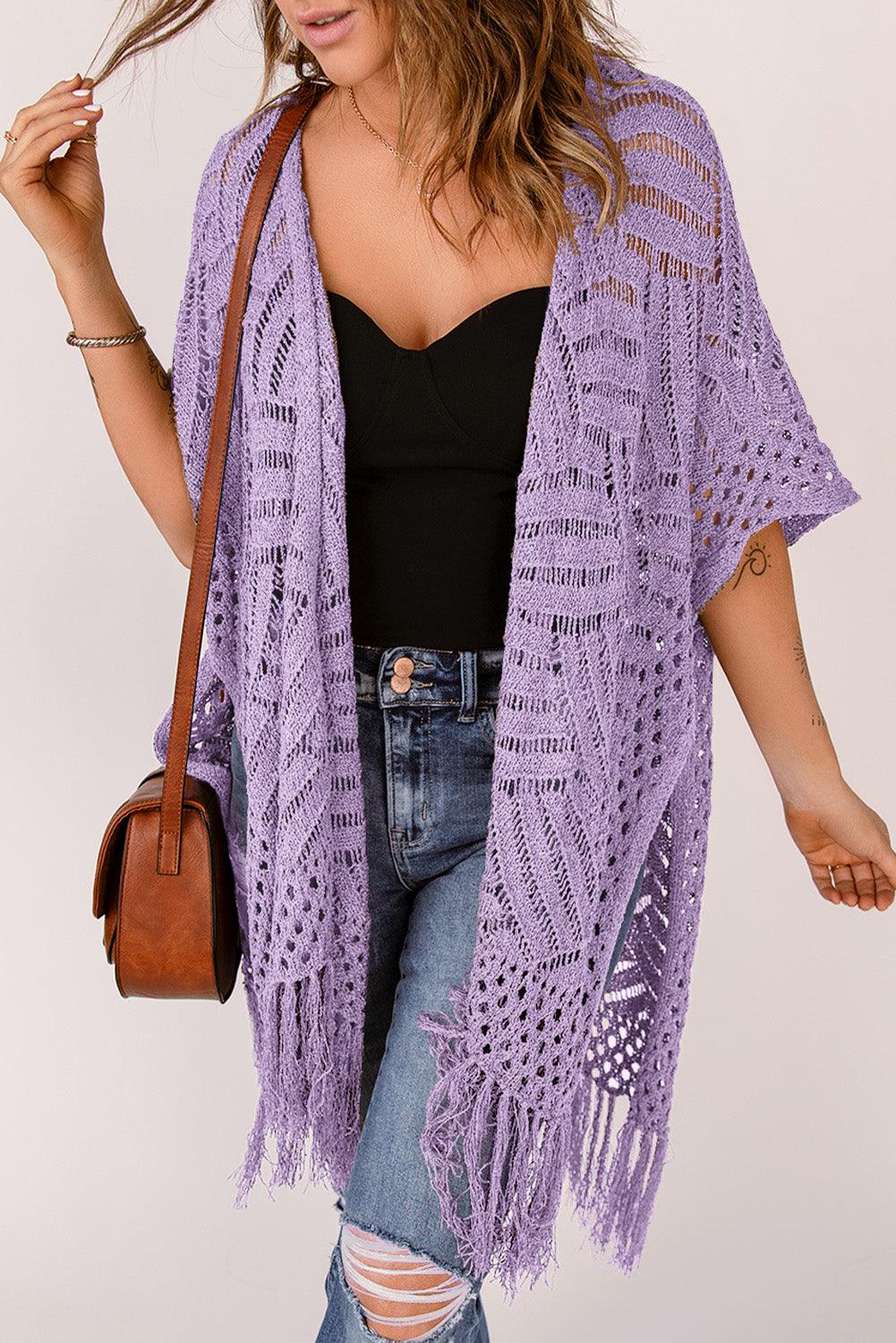 a woman wearing a purple crochet shawl