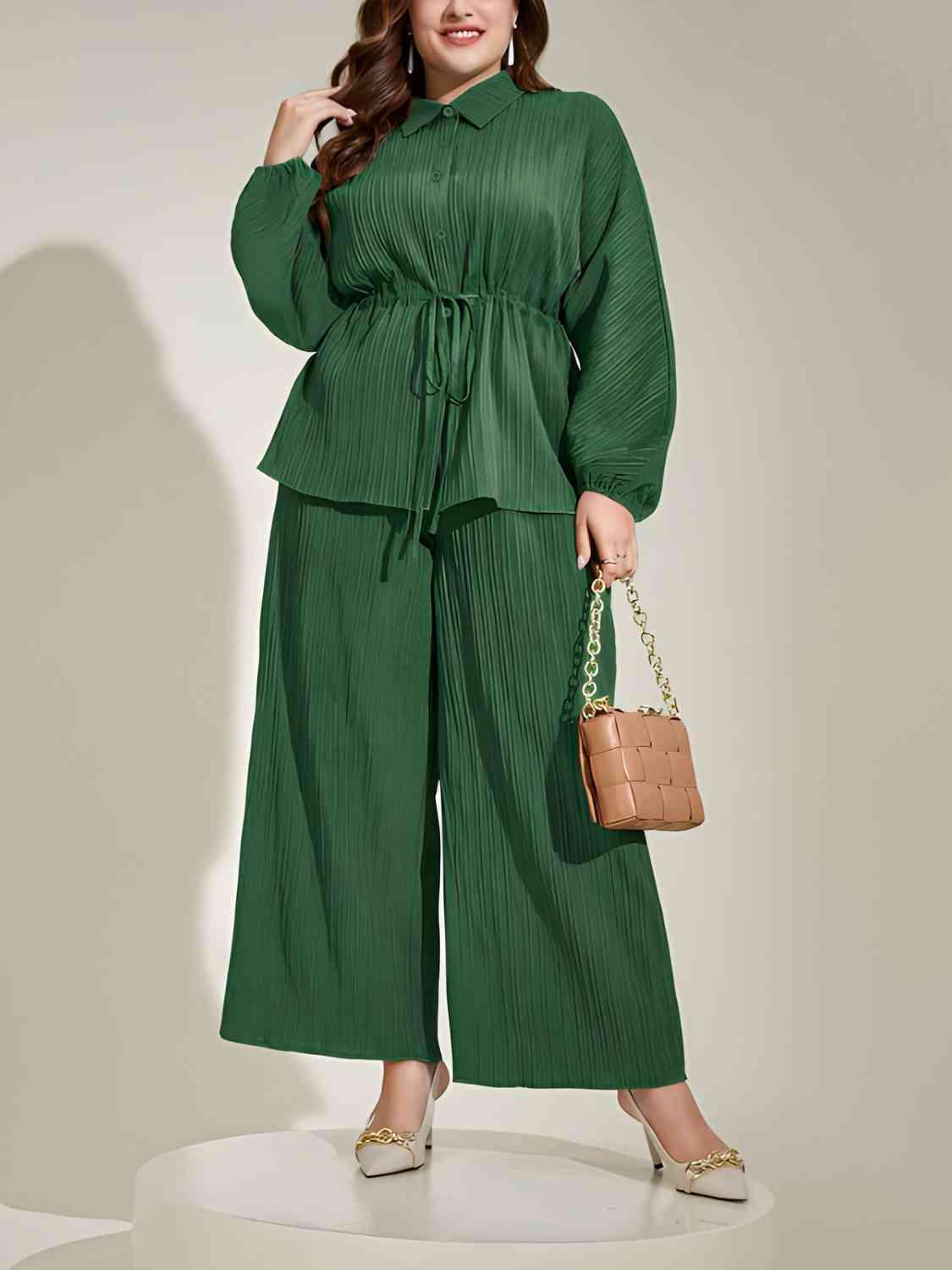 a woman in a green jumpsuit holding a purse
