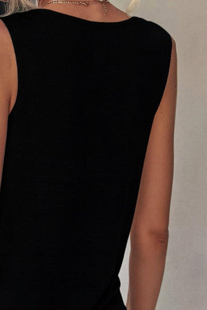 a woman with blond hair wearing a black dress