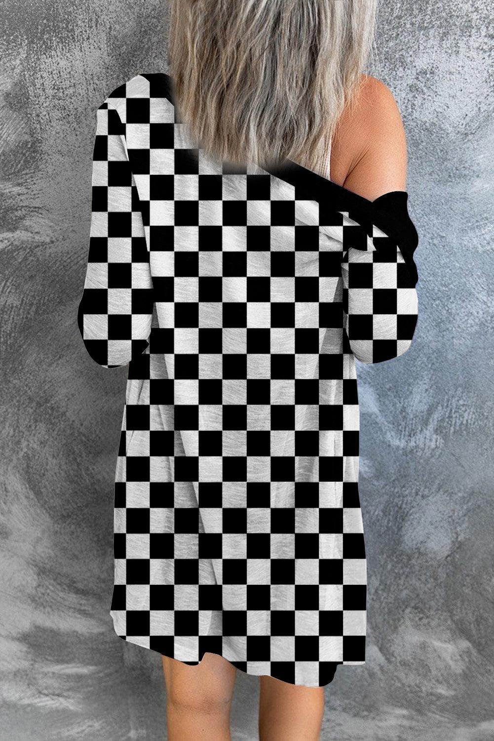 a woman wearing a black and white checkered dress