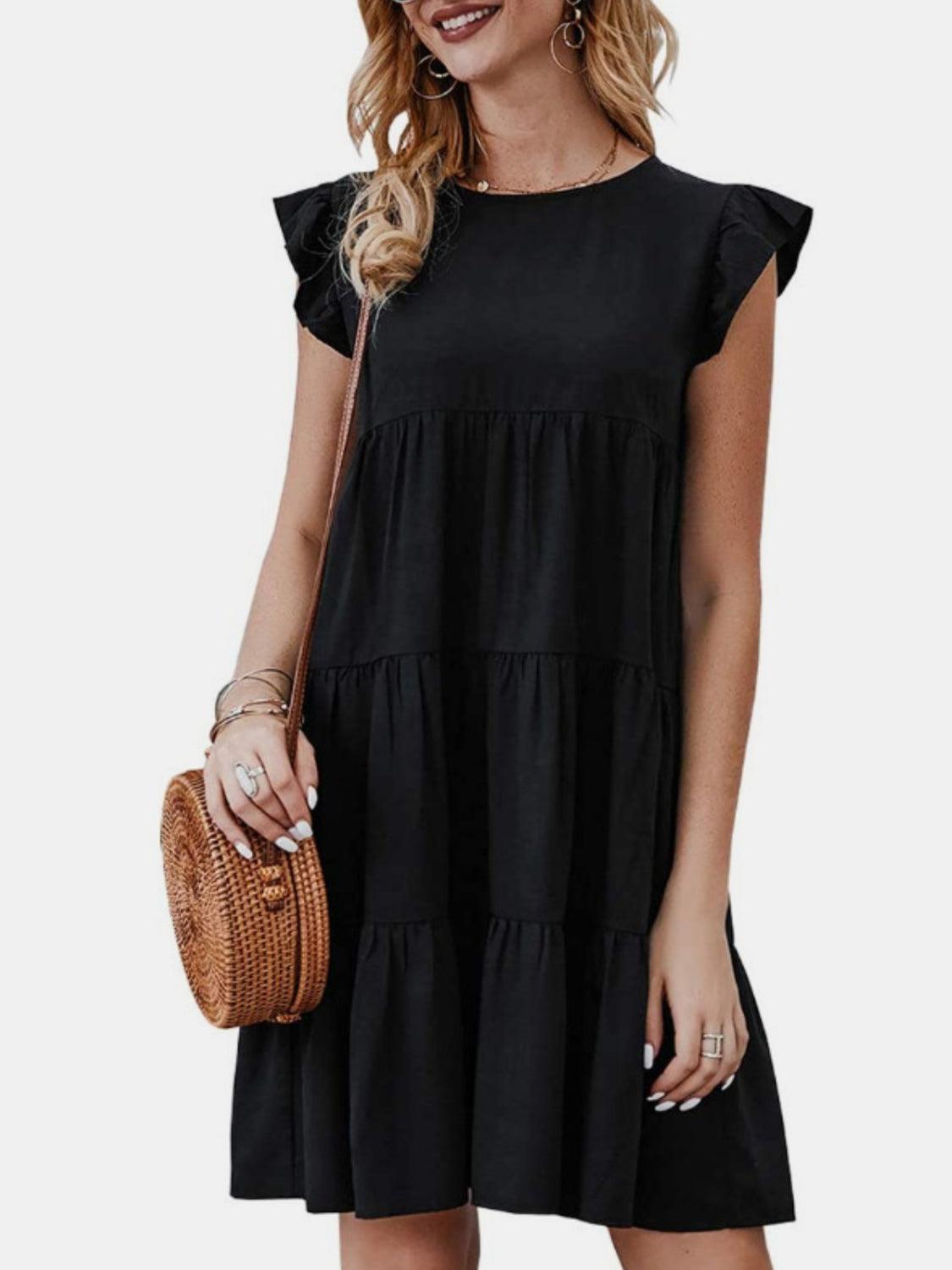 a woman in a black dress holding a basket