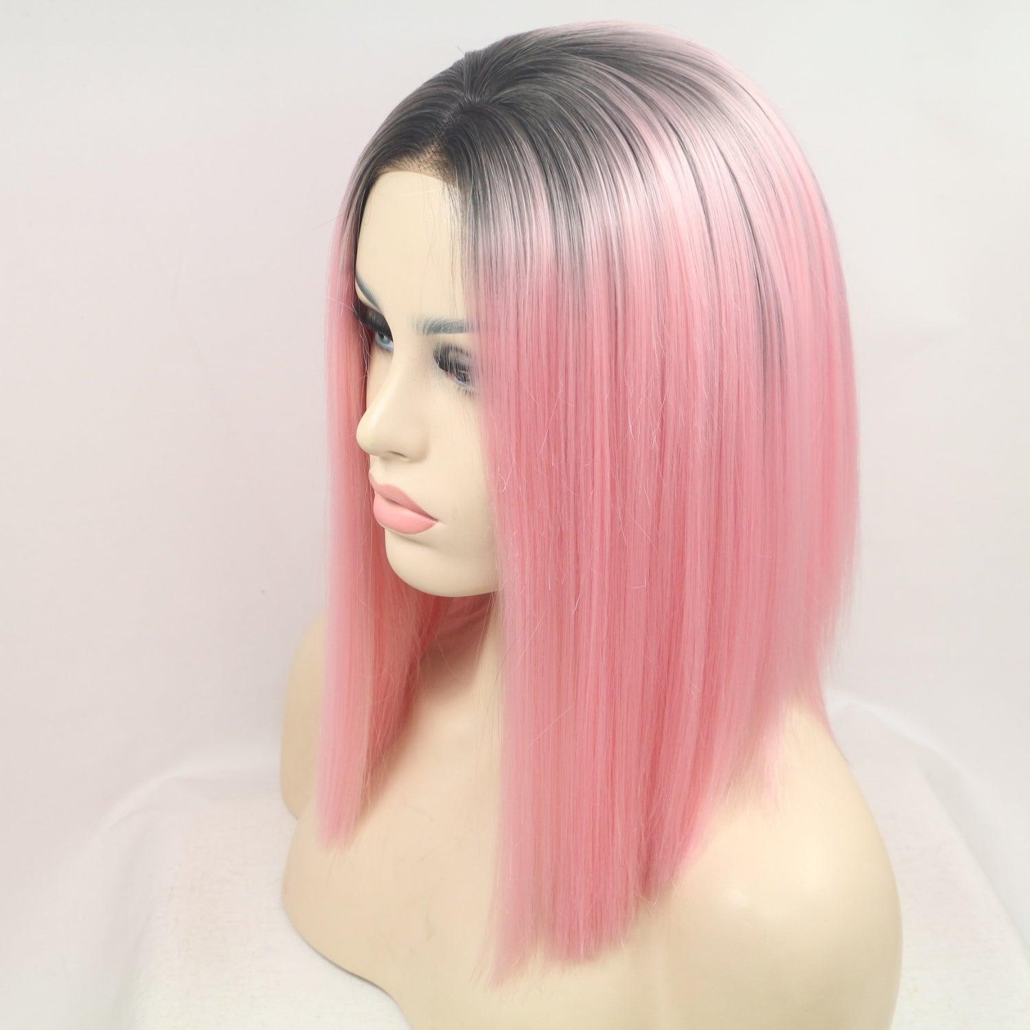 a mannequin head with pink and black hair