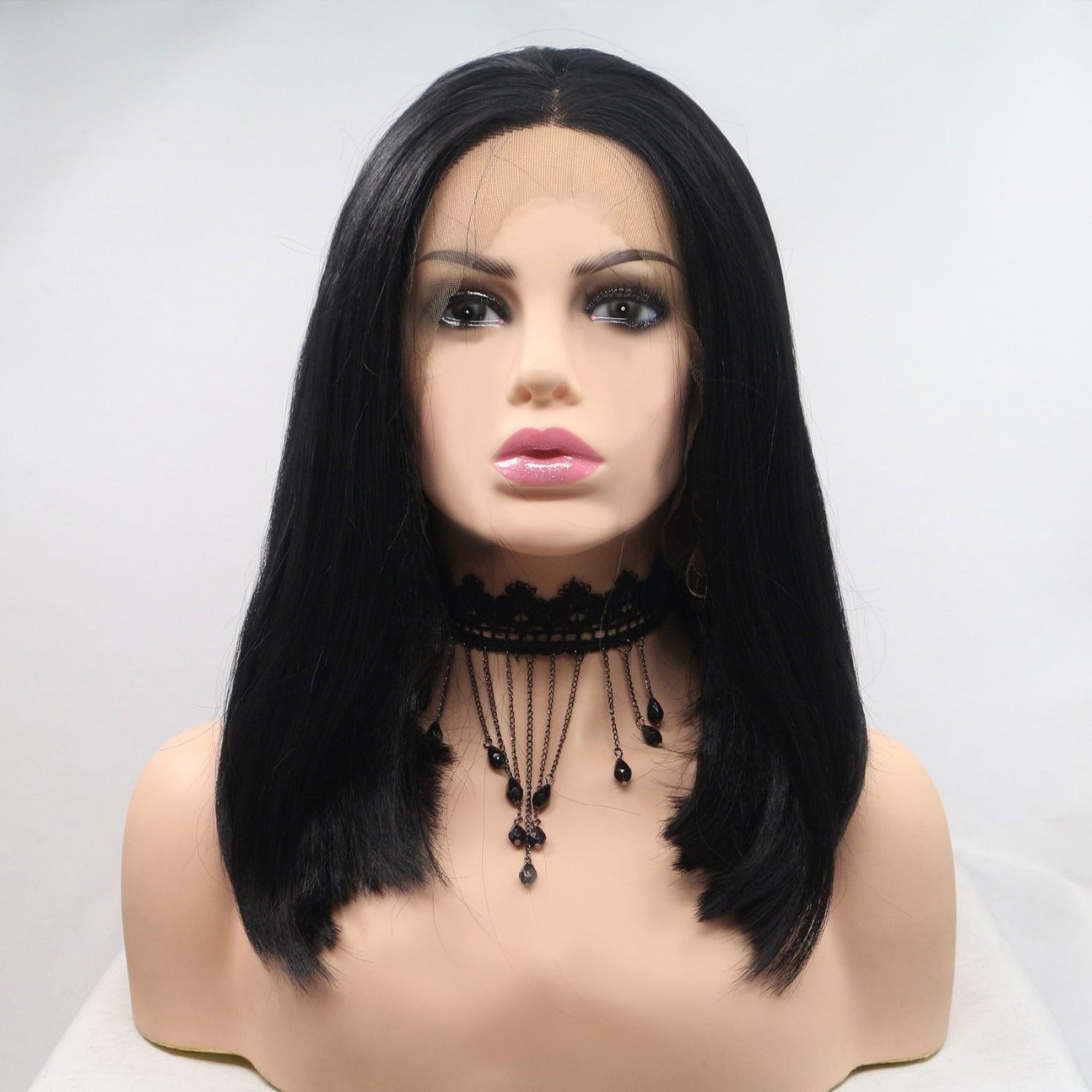a mannequin head wearing a black wig