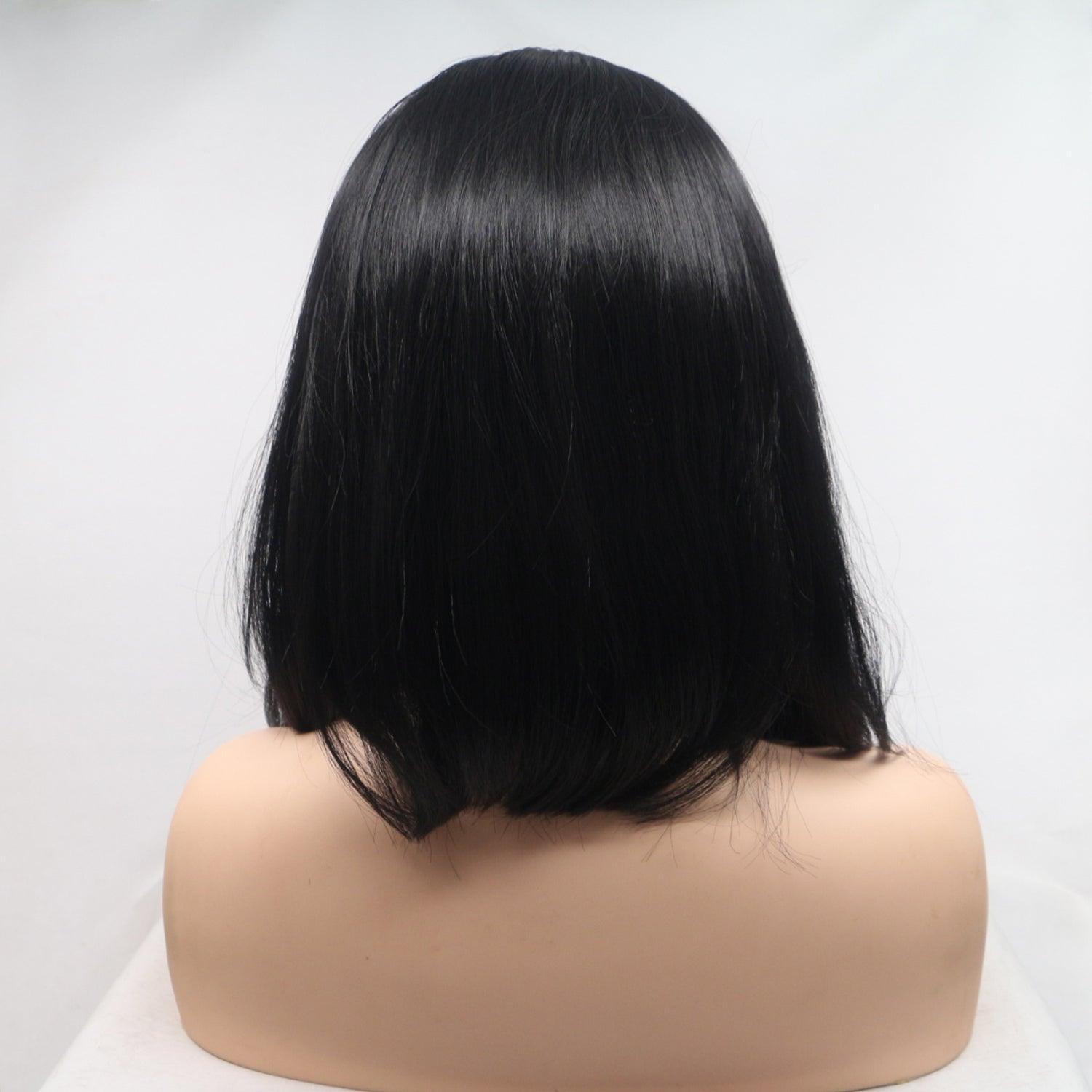 a black wig on a white mannequin head