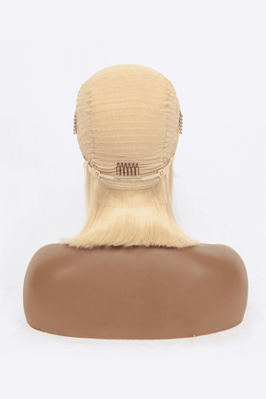 a wig on a mannequin head on a white background