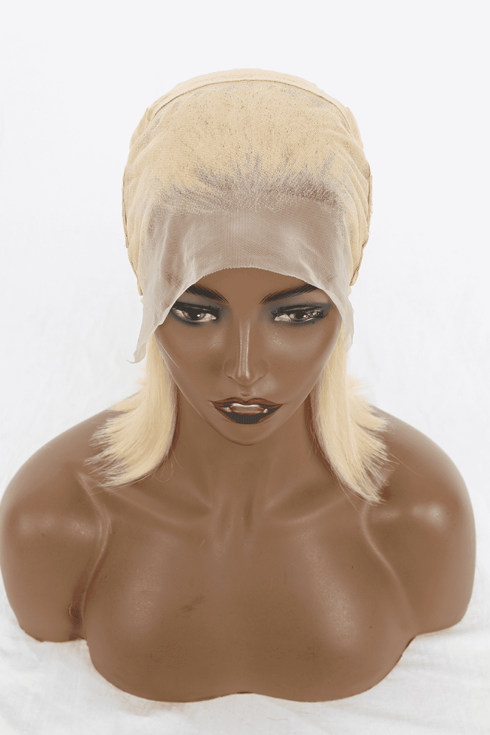 a mannequin head with a wig and a turban