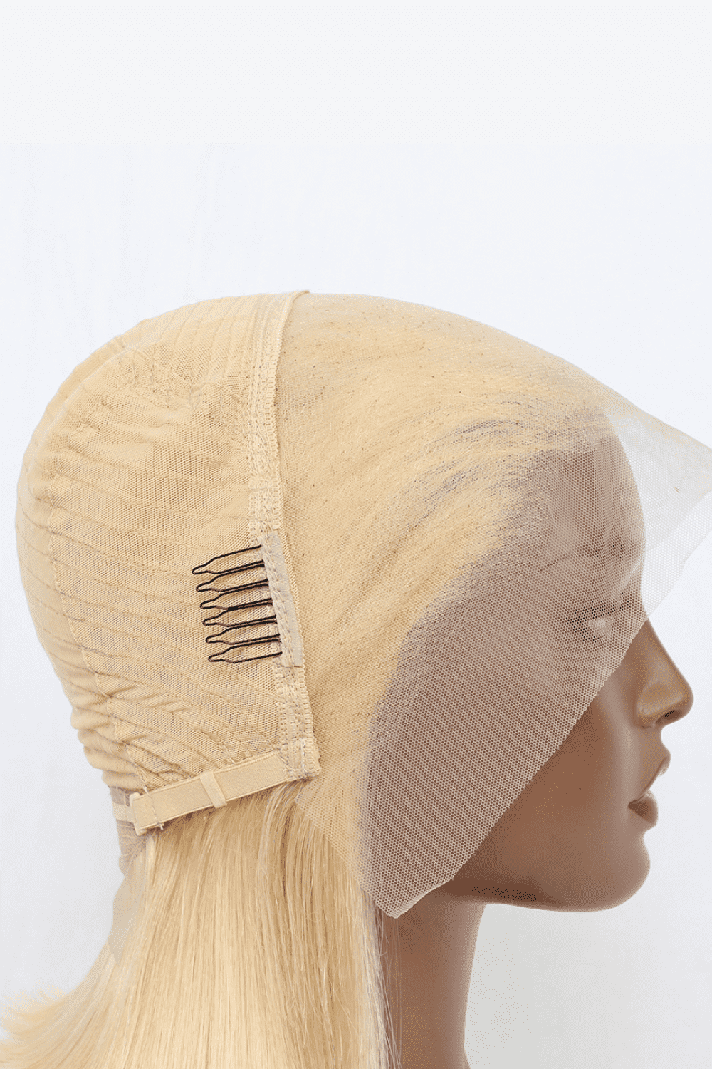 a wig with a comb on top of it