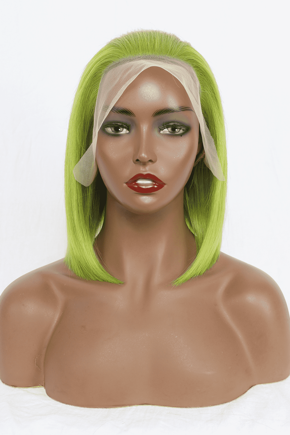 a mannequin head with a green wig