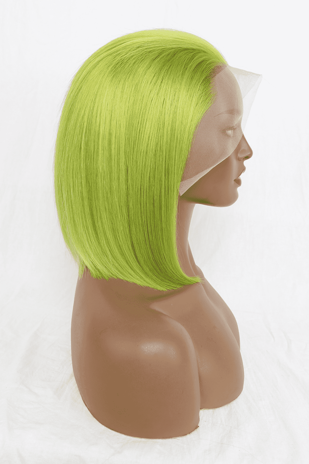 a mannequin head with a bright green wig