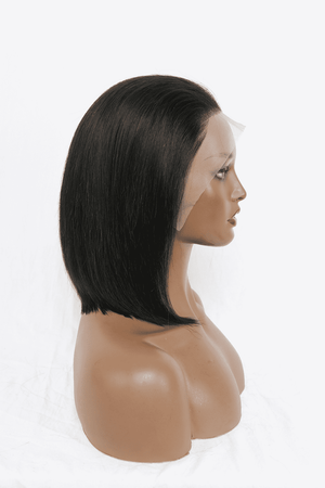 a mannequin head with a black wig on a white background