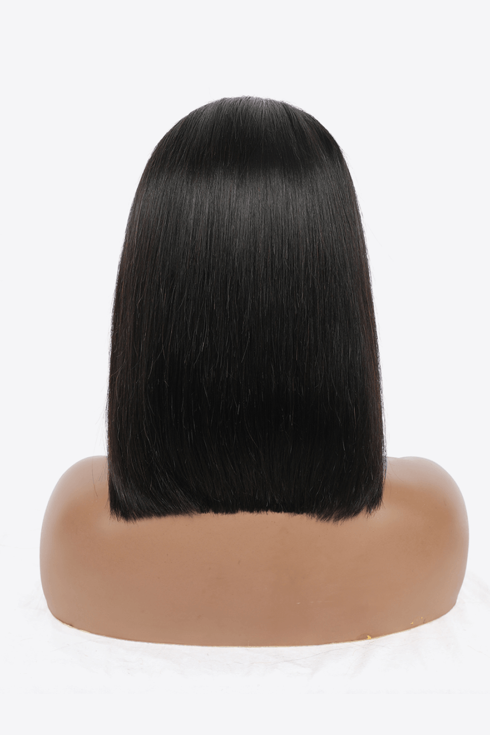 a wig on a mannequin head with a white background