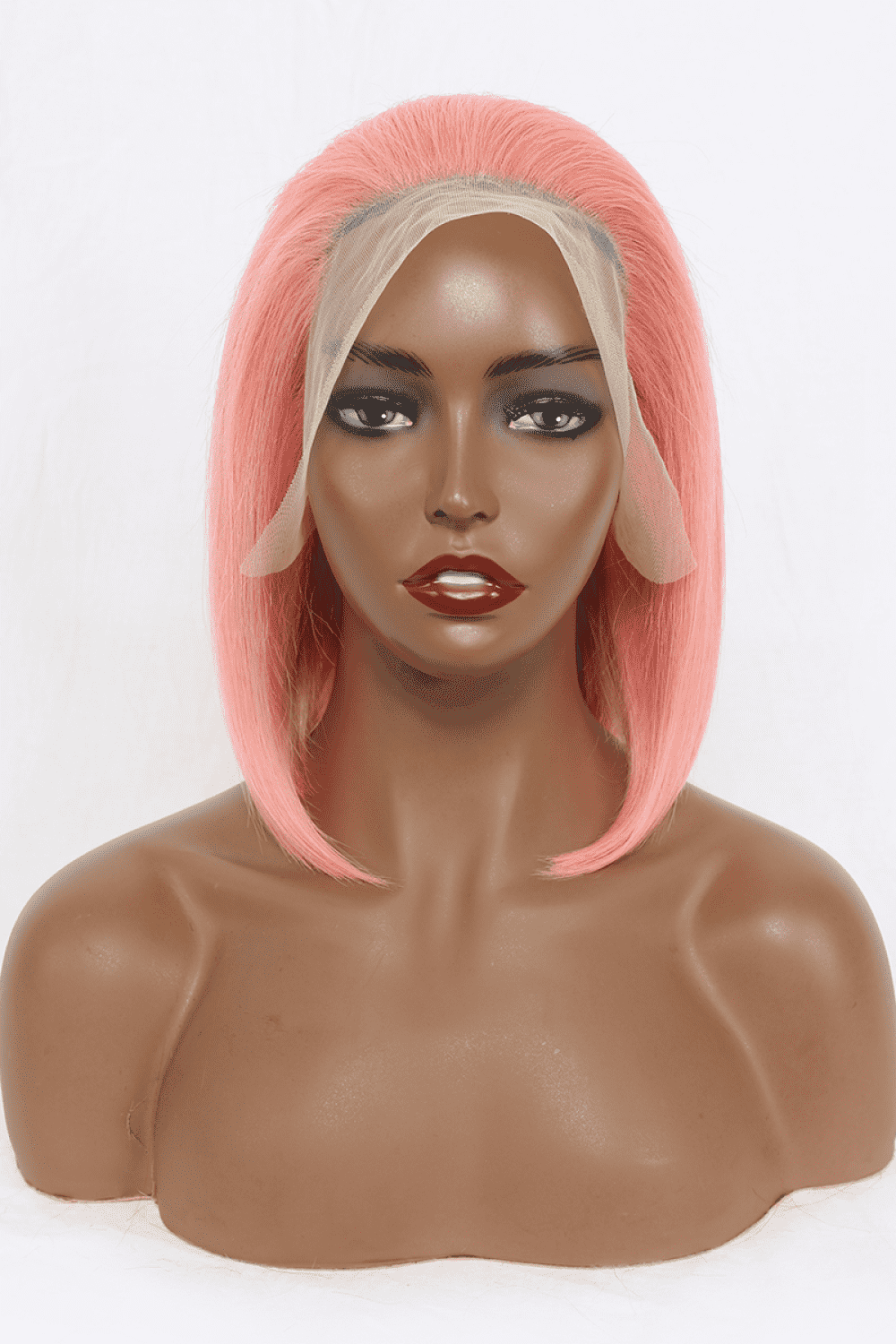 a mannequin head with a pink wig