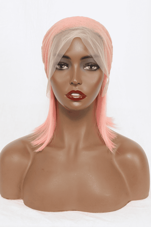 a mannequin with pink hair wearing a wig
