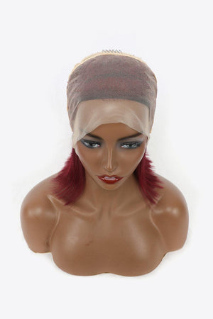 a mannequin head with a wig and a red wig