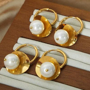 three pairs of gold and white pearl earrings