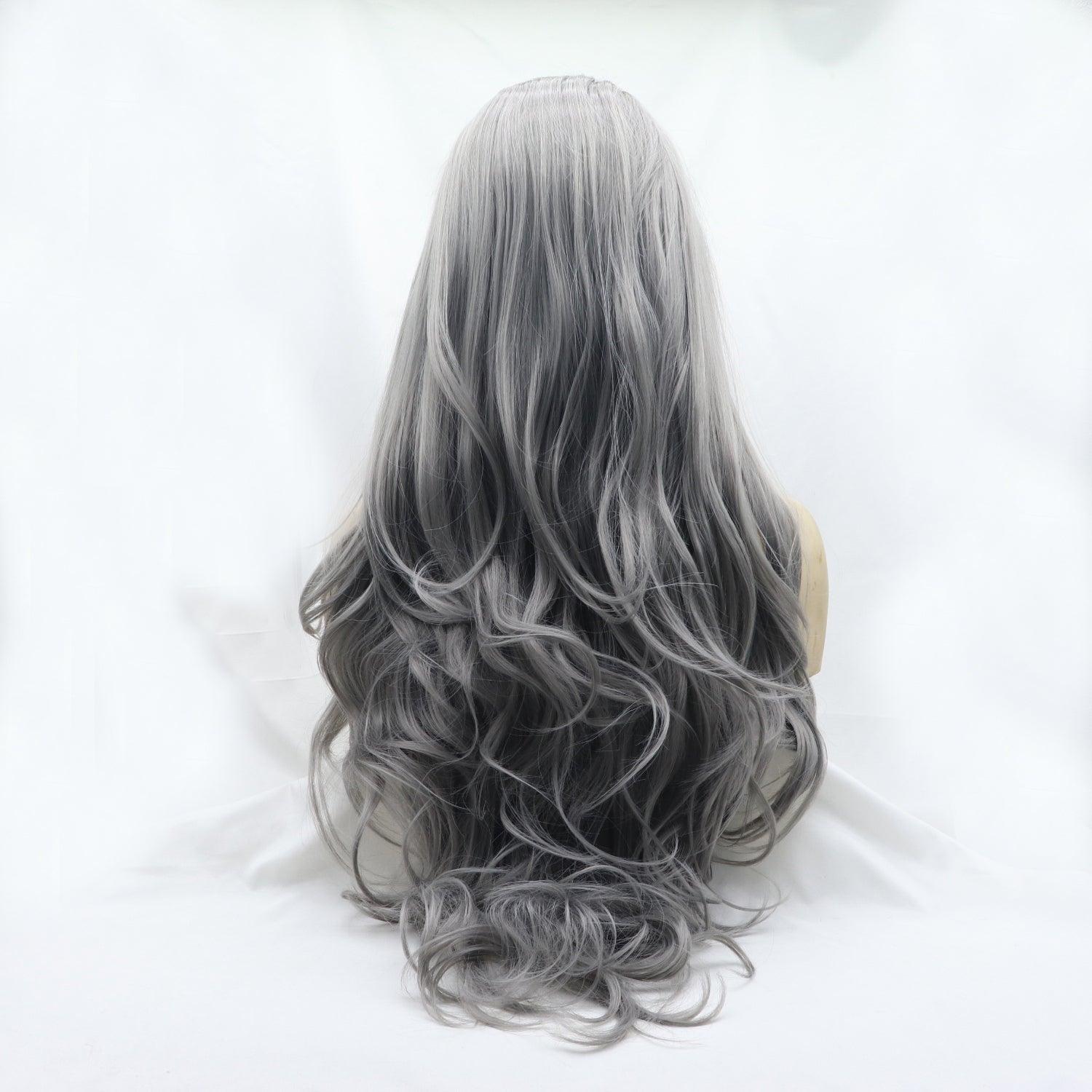 a woman's long grey hair is shown from the back