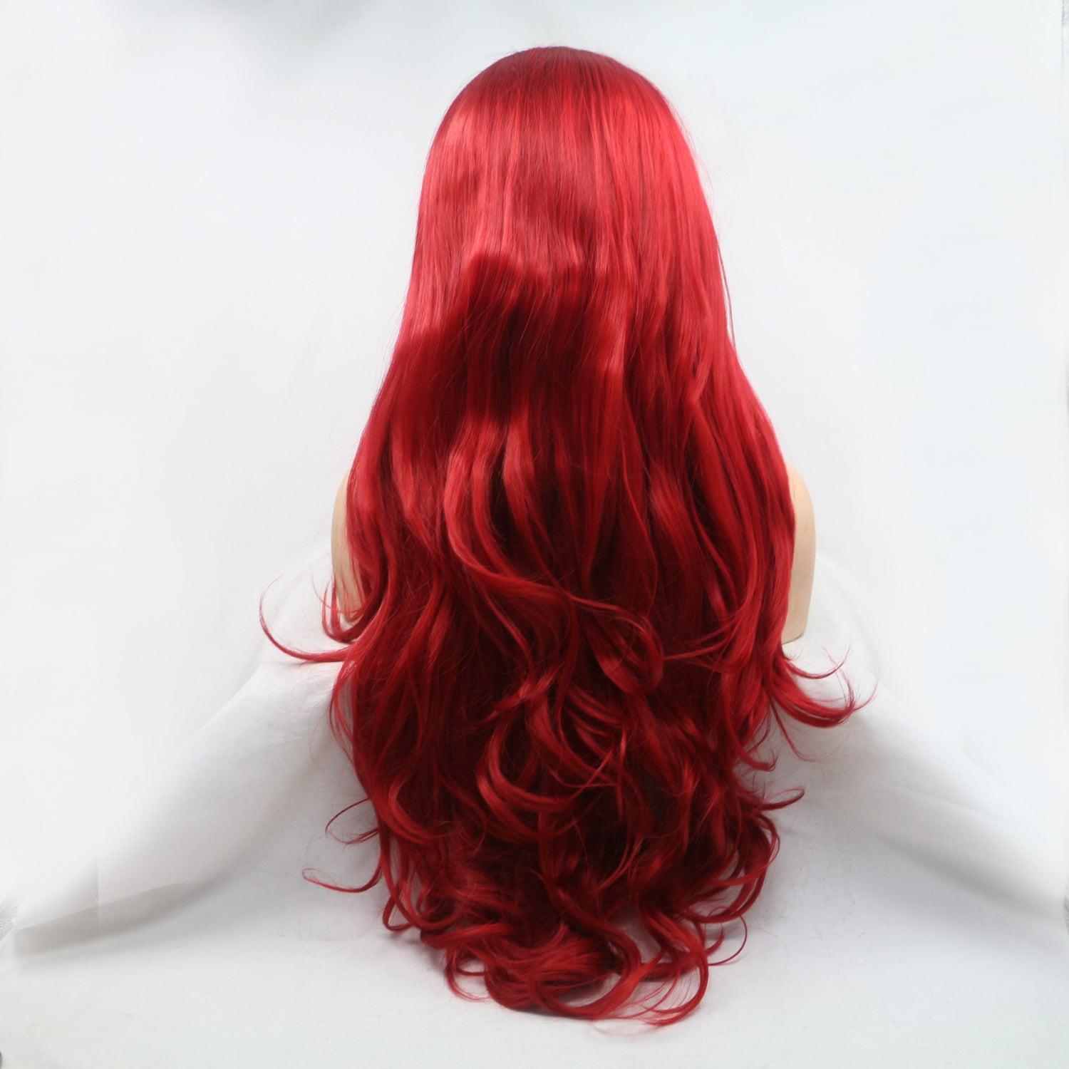 a red wig with long wavy hair on a mannequin head