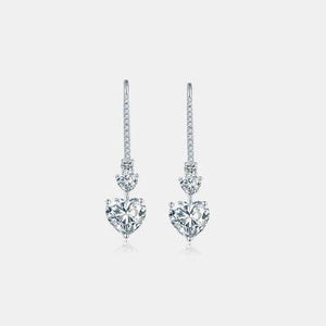 a pair of heart shaped diamond earrings
