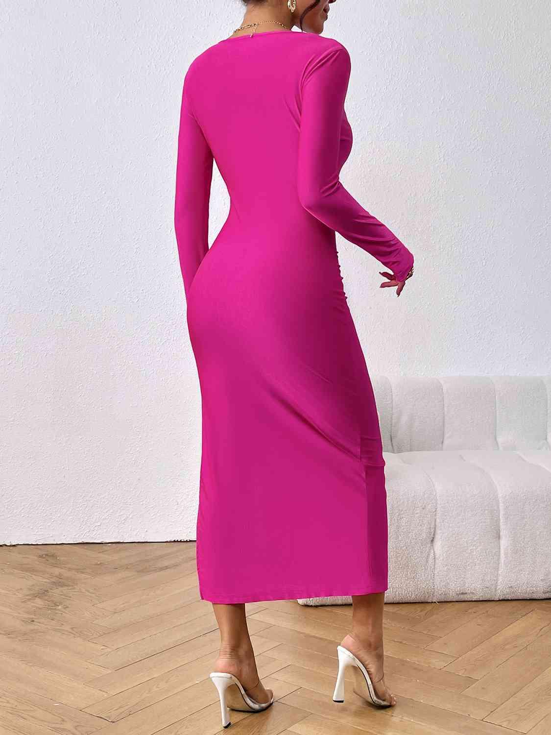 a woman in a bright pink dress