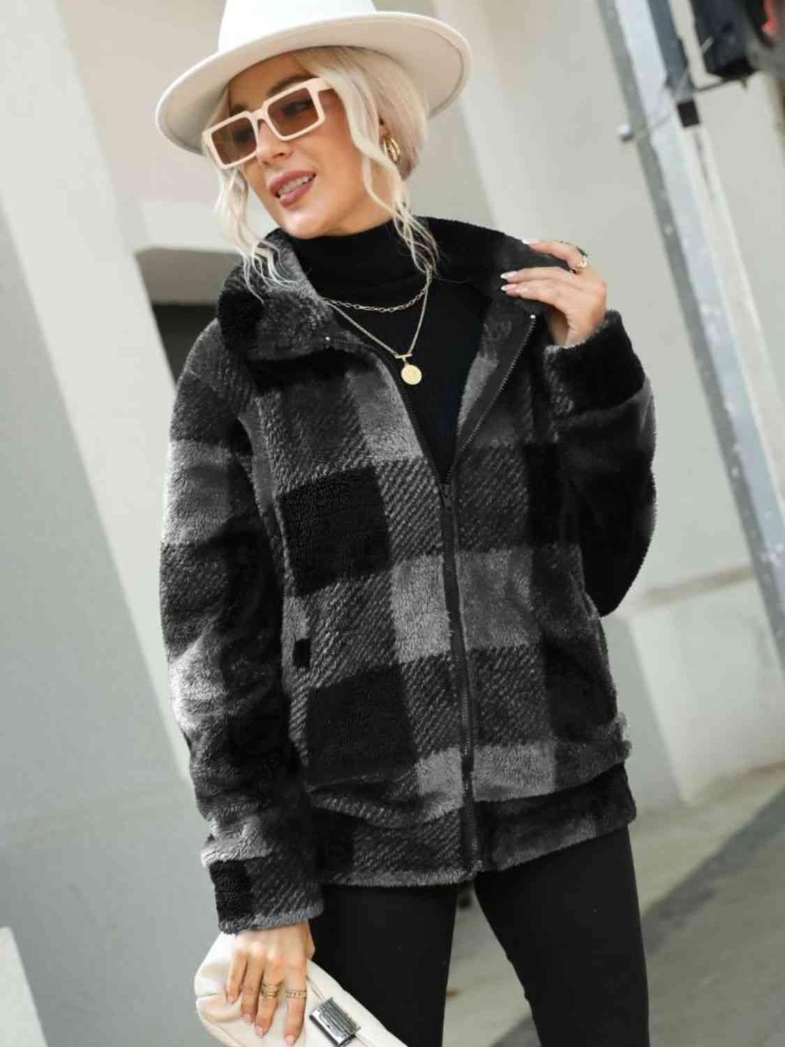 a woman wearing a black and white checkered coat