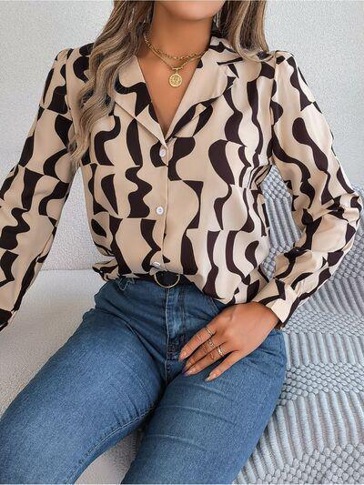 a woman sitting on a bed wearing a shirt and jeans